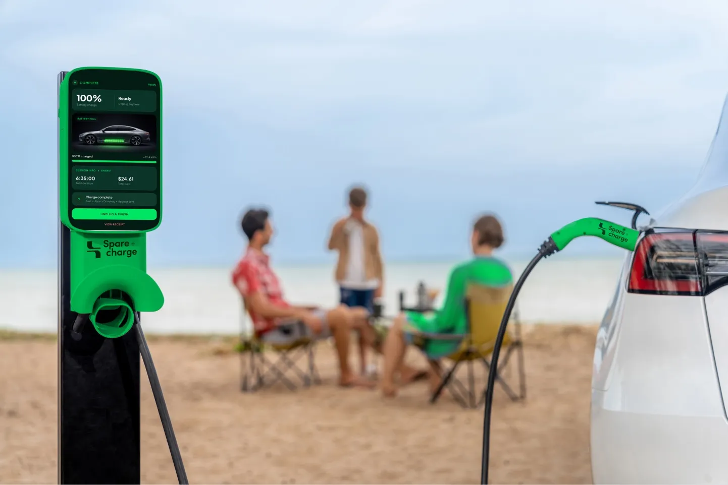 Family on the beach while their electric car charges at a SpareCharge charger