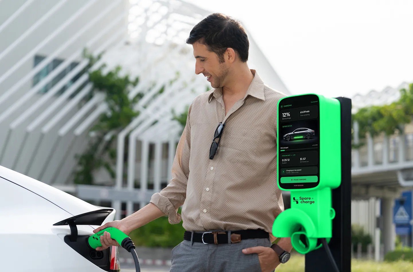Man plugging in his car at a SpareCharge charger