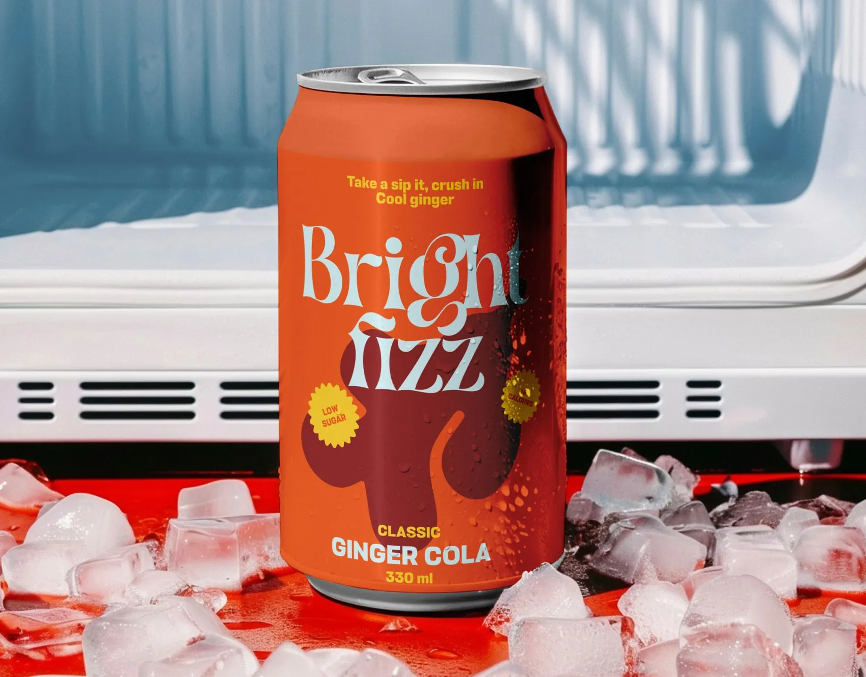 Orange Bright Fizz ginger cola can on ice in front of an open fridge