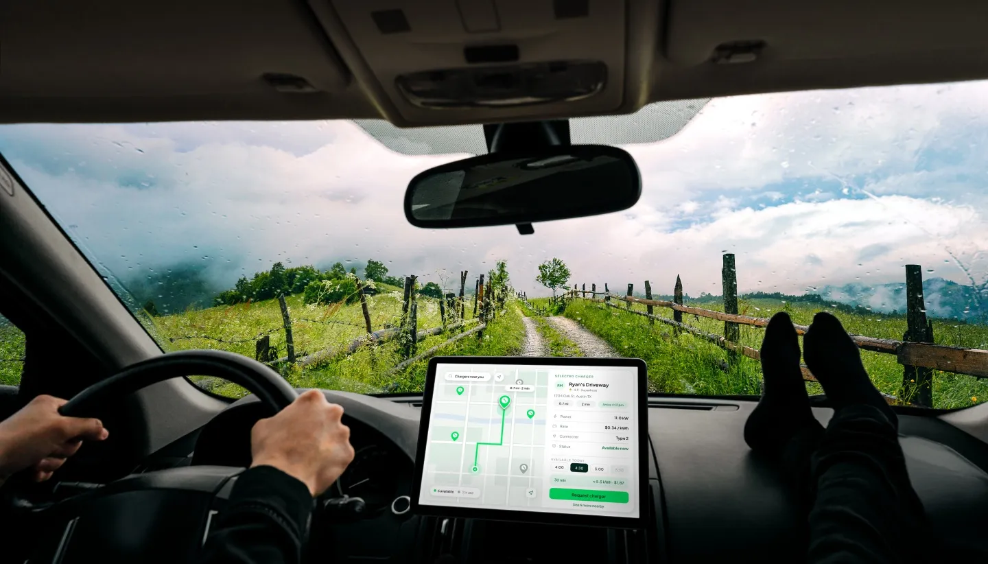 The SpareCharge app on a car dashboard screen, seen from the driver’s seat