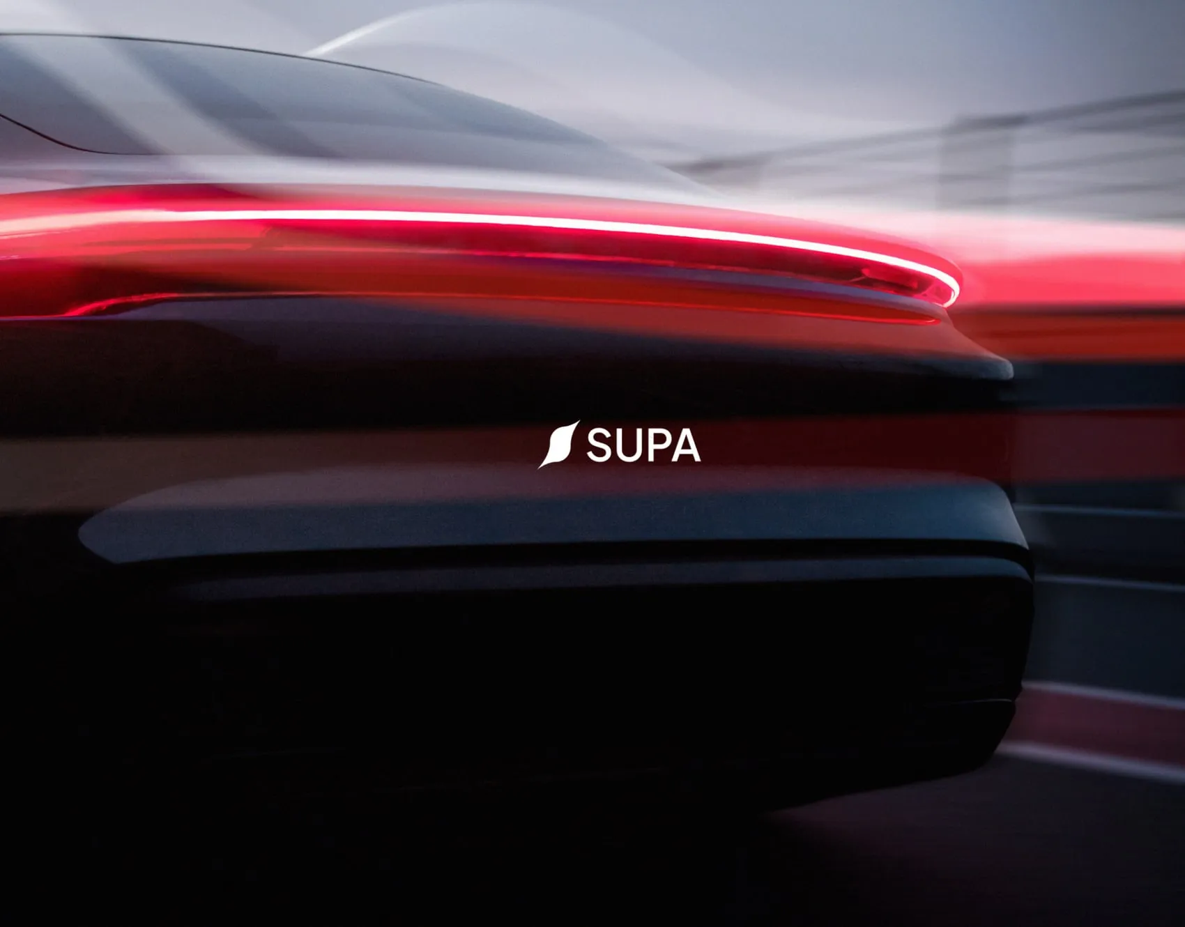 SUPA logo over the glowing red tail light of a dark electric car