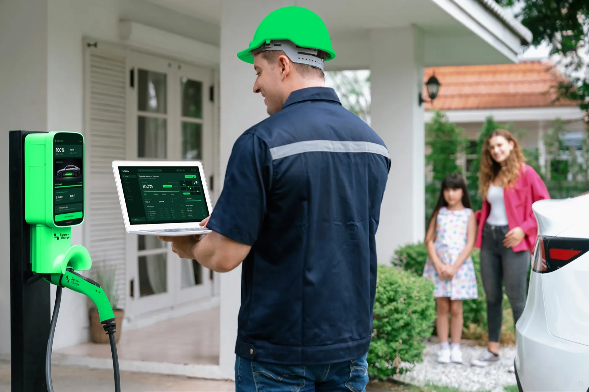 Technician installing a SpareCharge charger at a family home