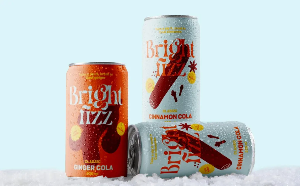 Bright Fizz ginger cola and cinnamon cola cans on snow