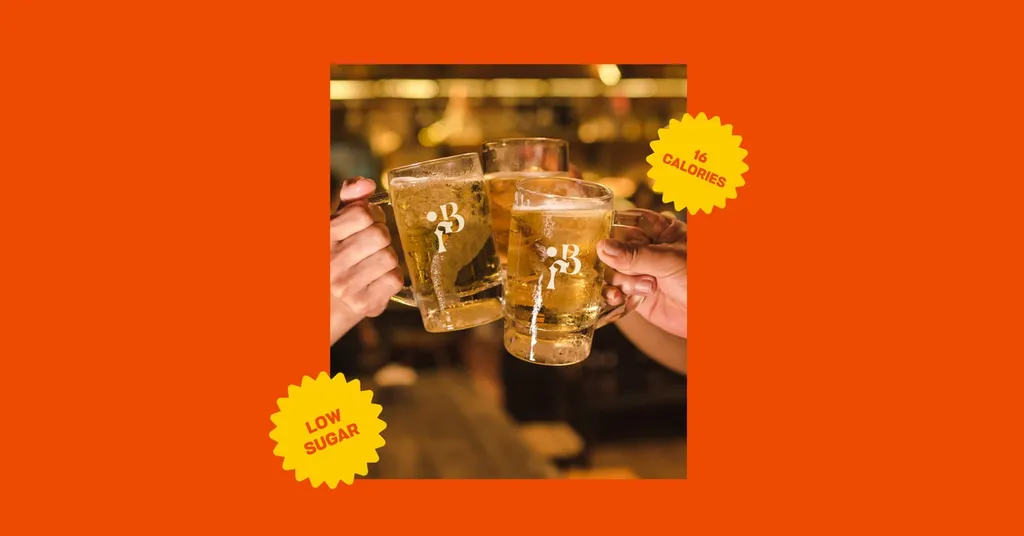 Glasses clinking in a bar on an orange board with Bright Fizz stickers