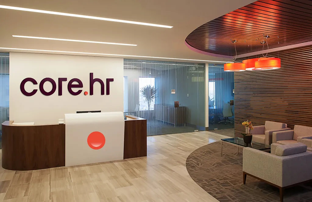 Office reception with the core.hr logo on the wall and a red circle on the front desk