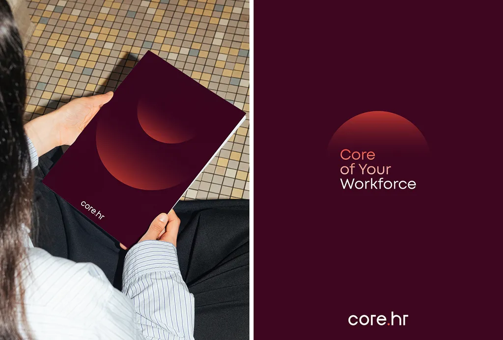 Person holding a burgundy core.hr notebook next to a poster: “Core of Your Workforce”