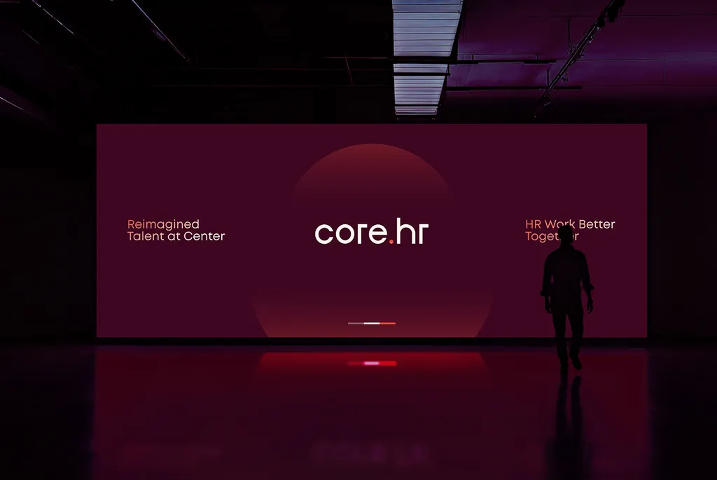 Dark stage with a large core.hr screen: “Reimagined talent at center”