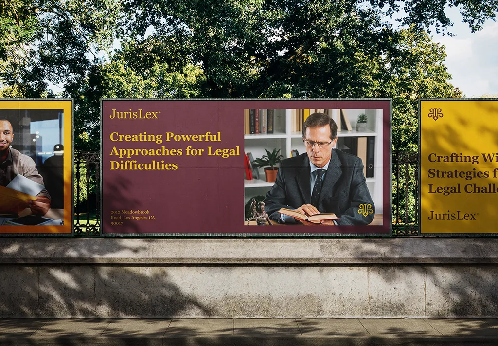 JurisLex burgundy and yellow posters on a park fence, the middle one showing a lawyer reading a book