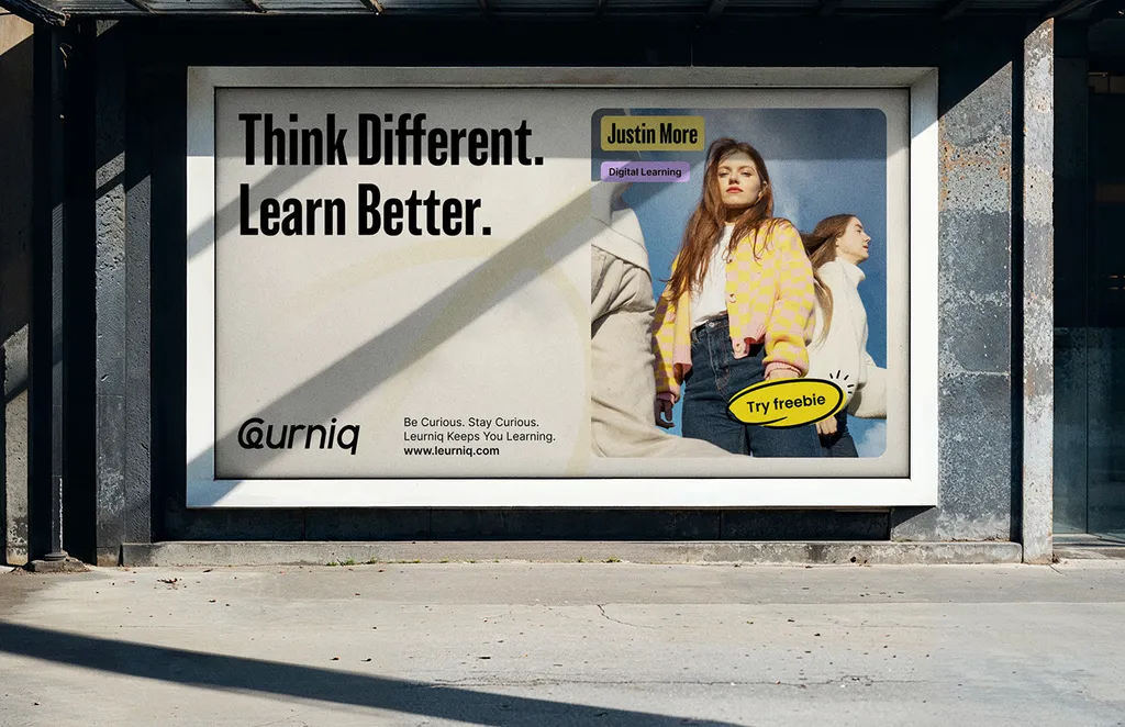 Leurniq billboard on a concrete wall: “Think Different. Learn Better.” with a woman in a yellow cardigan