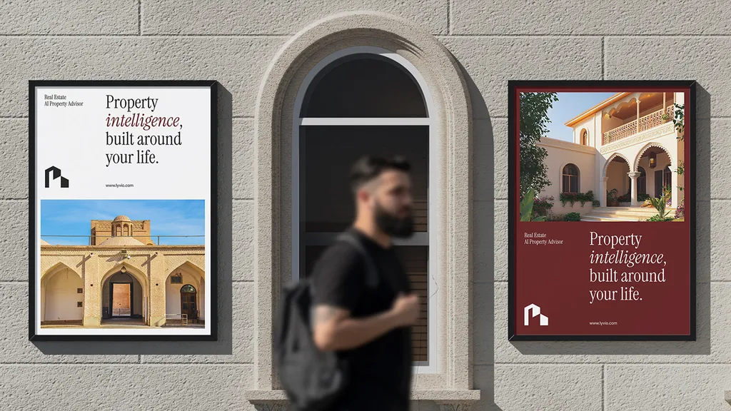 Man walking past Lyvio posters on a stone wall