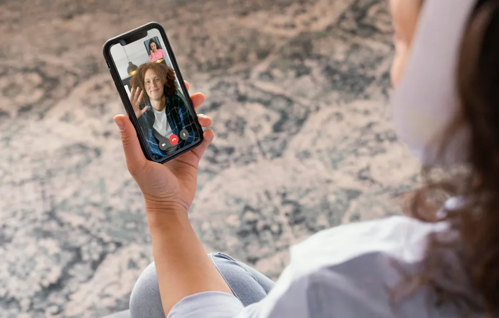 Woman holding a phone during a video session