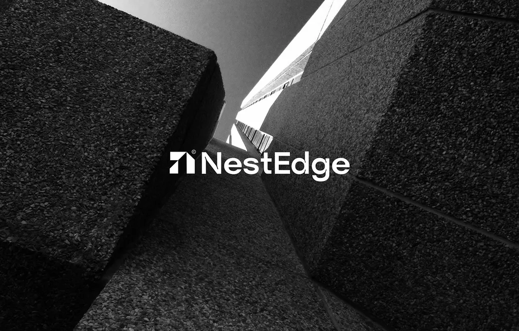 NestEdge logo in white over a low-angle black and white photo of textured concrete towers