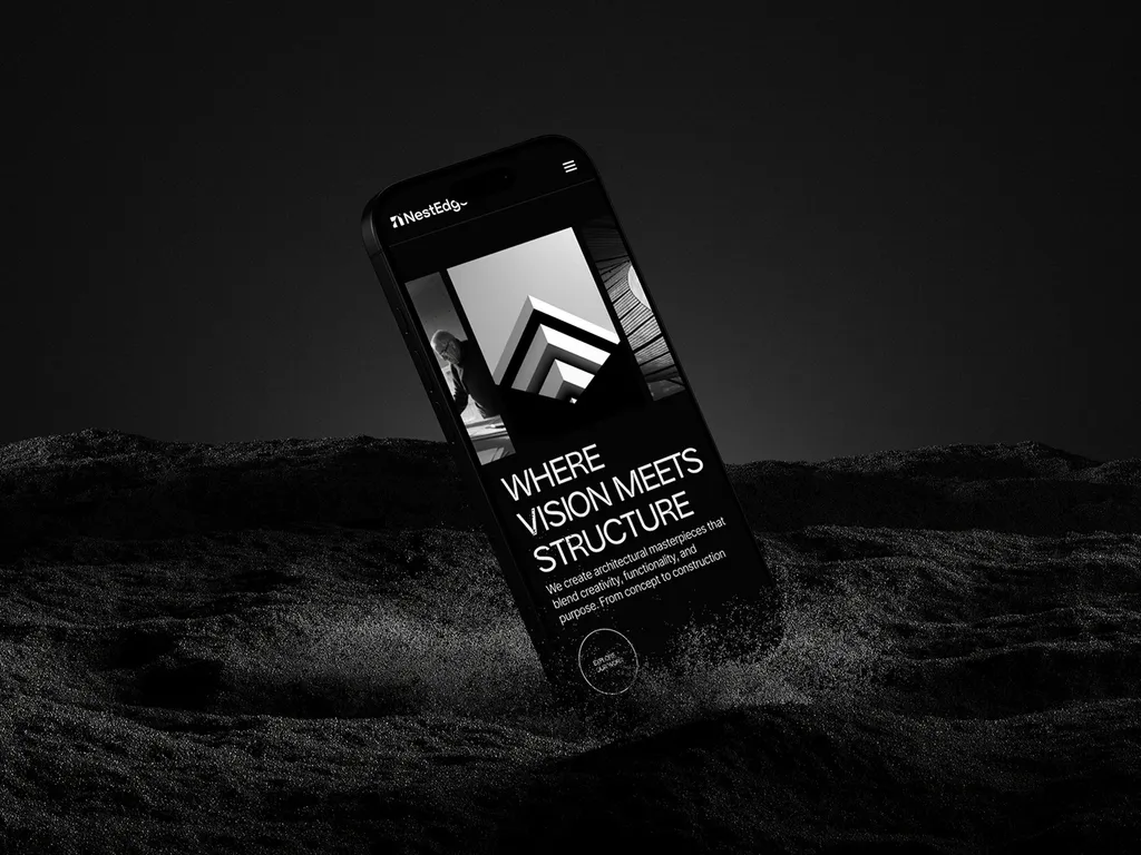 NestEdge mobile site on a phone half-buried in dark sand: “Where vision meets structure”