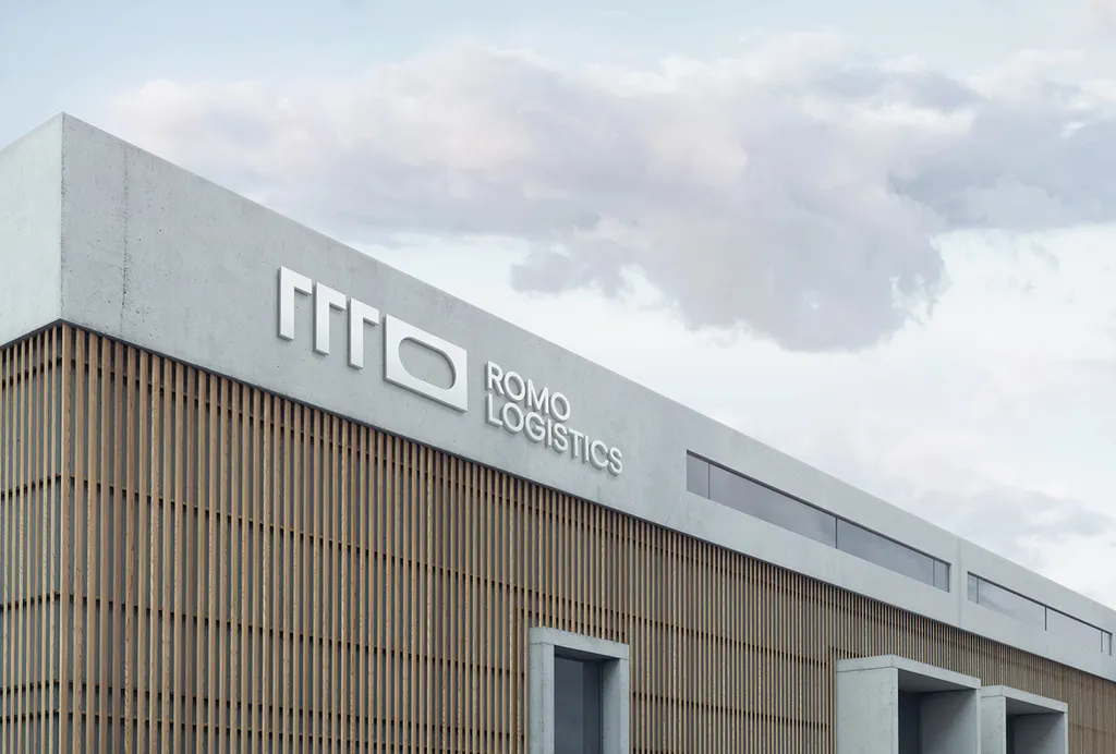 ROMO Logistics sign on a modern warehouse facade
