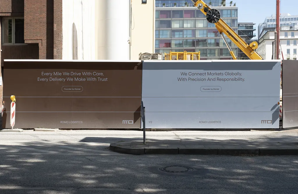 ROMO hoarding panels with brand messages along a city street