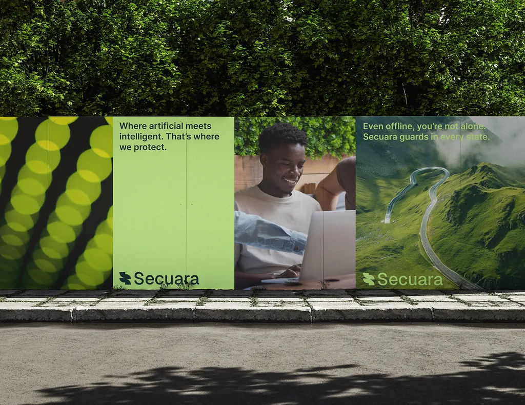 Secuara posters on a street billboard in front of a hedge