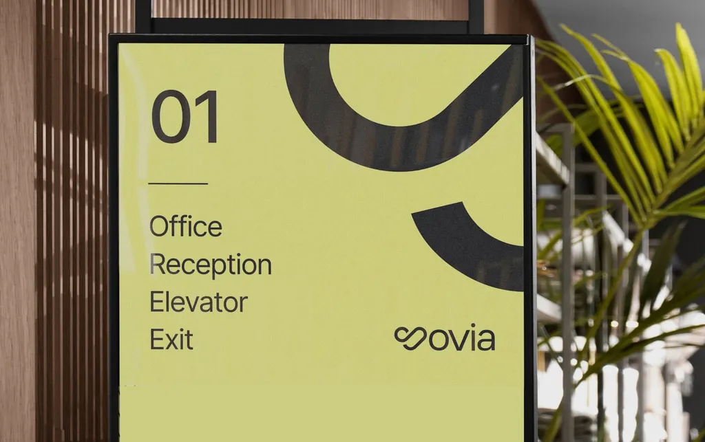 Yellow Sovia wayfinding sign for office, reception, elevator and exit
