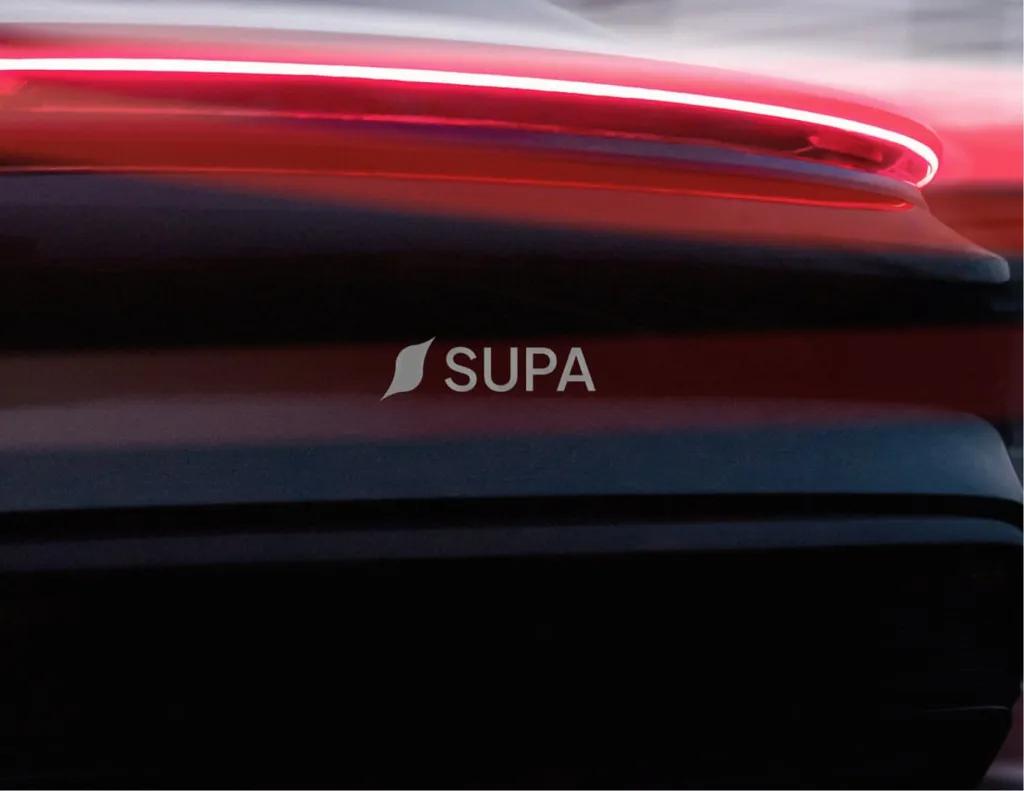 SUPA wordmark over the glowing red tail light of a dark electric car