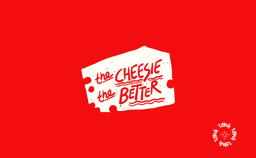 Tong “the cheesie the better” sticker in white on red