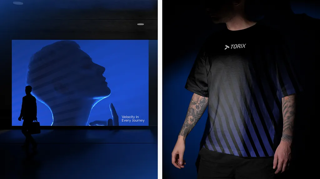 TORIX screen in a dark lobby, “Velocity In Every Journey”, next to a man in a black TORIX t-shirt with blue stripes