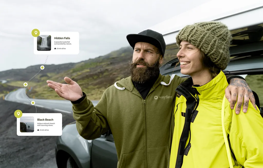 Two hikers laughing outdoors with Wayfare trip cards floating beside them