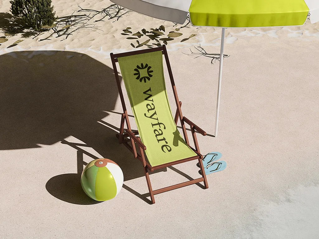Lime Wayfare deck chair and a beach ball on the sand